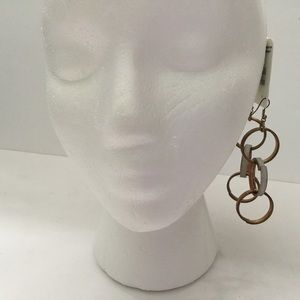 Loop earrings. Three tiers, shining gold/white
4.5” long